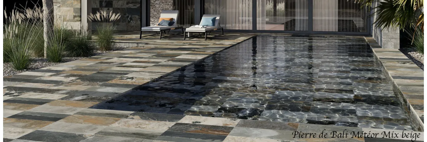 carrelage extérieur pierre de bali météor mix terre beige dans les ton noir, marron pour le contour piscine