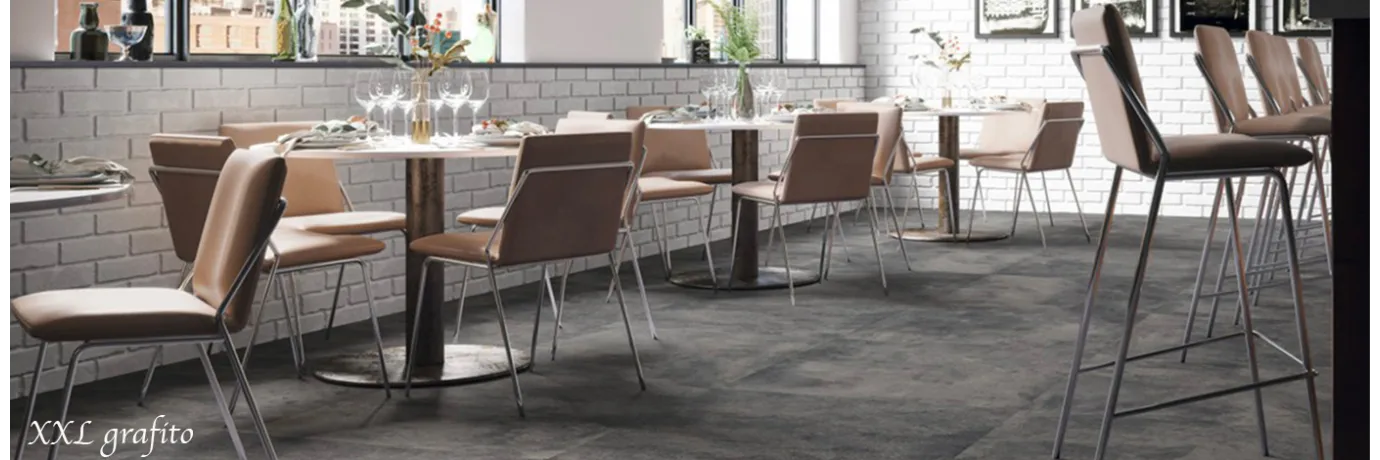 Carrelage sol effet béton XXL grafito gris foncé pour un bar